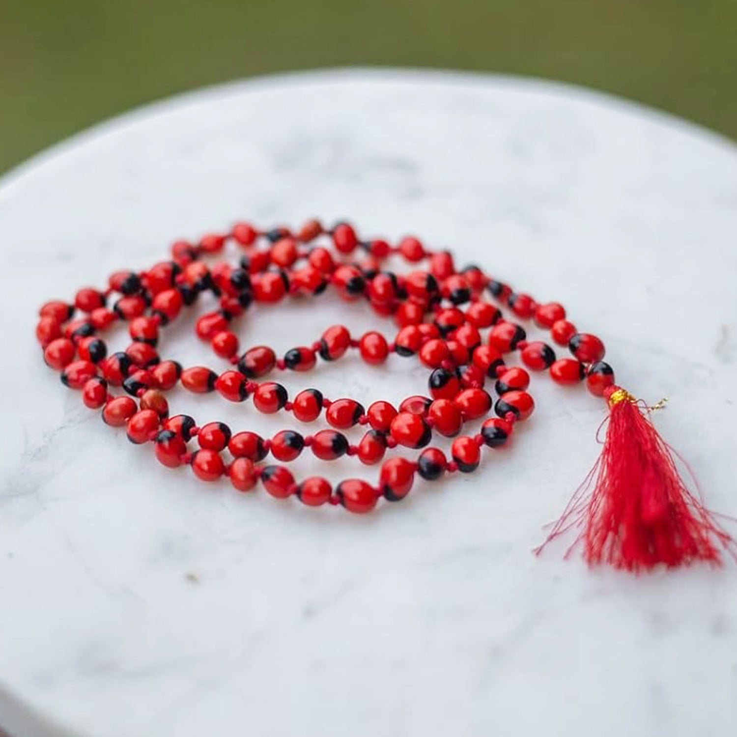 Natural Red Gunja Ratti Chirmi Mala with vibrant red and black beads for spiritual connection and prayer.