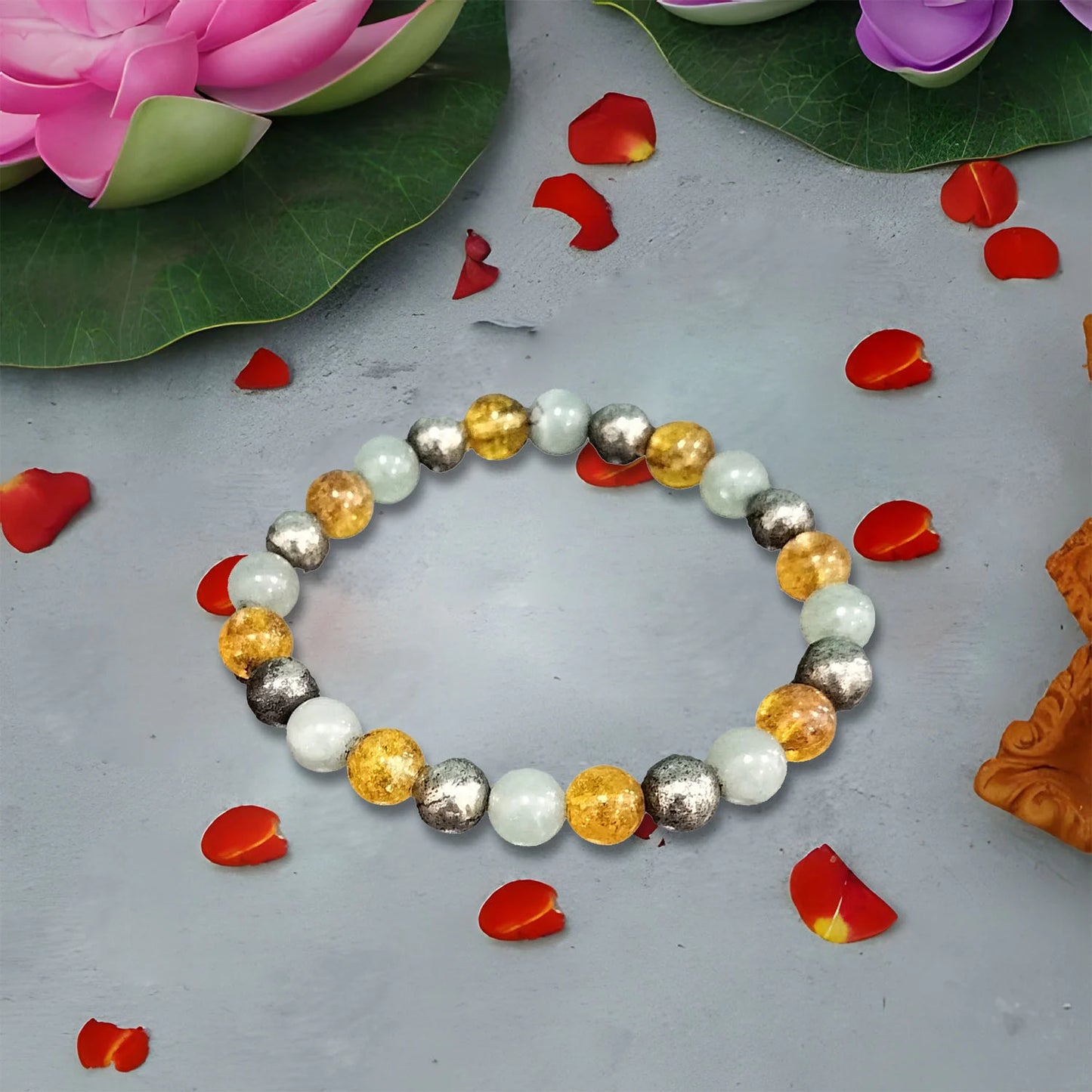 Close-up view of Money Magnet Bracelet with green aventurine, citrine, and pyrite stones for financial success.