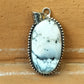Hand Holding White Howlite Pendant – Healing Stone Jewelry for Anxiety, Sleep, and Creative Focus