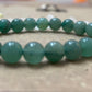 Emotional Healing with Green Aventurine Bracelet - Focus on a person wearing the bracelet, promoting emotional balance and healing.

