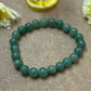 Green Aventurine Bracelet for Positive Energy and Cleansing - A close-up shot of the bracelet symbolizing cleansing of blockages and enhancing positivity.