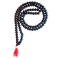 A close-up of the Narayan Shaligram Mala with 108 beads, showcasing the black Shaligram stones and intricate bead arrangement.